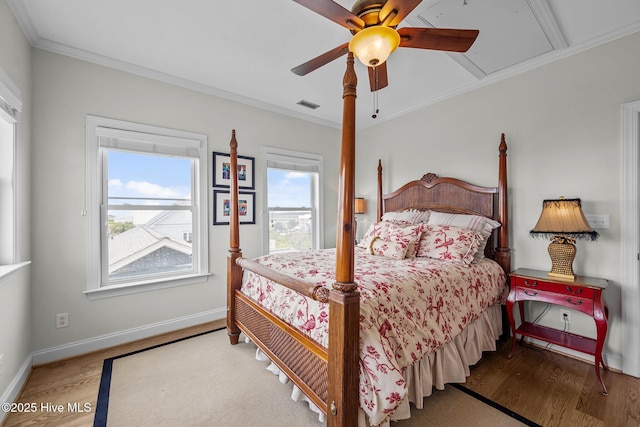 120 Windjammer Dr, Surf City, NC 28445 - bedroom featuring wood finished floors, ornamental molding, attic access, and ceiling fan