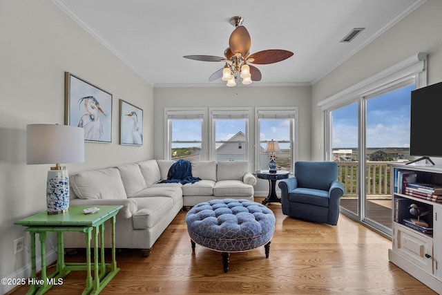 120 Windjammer Dr, Surf City, NC 28445 - living area featuring plenty of natural light, ceiling fan, wood finished floors, and crown molding