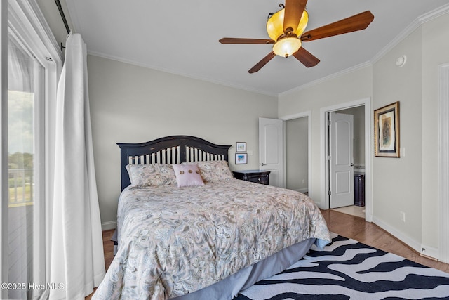 120 Windjammer Dr, Surf City, NC 28445 - bedroom featuring ornamental molding, wood finished floors, ensuite bath, and ceiling fan