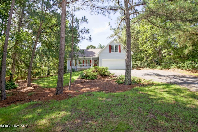 130 Pinecone Ct, Seven Lakes, NC 27376 - traditional home featuring driveway, a garage, a front lawn, and covered porch