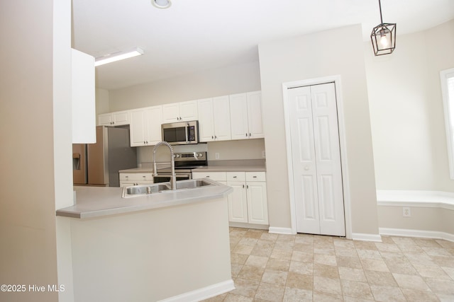 130 Pinecone Ct, Seven Lakes, NC 27376 - kitchen featuring appliances with stainless steel finishes, white cabinetry, and light countertops