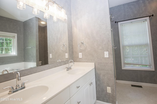 130 Pinecone Ct, Seven Lakes, NC 27376 - bathroom with double vanity and baseboards