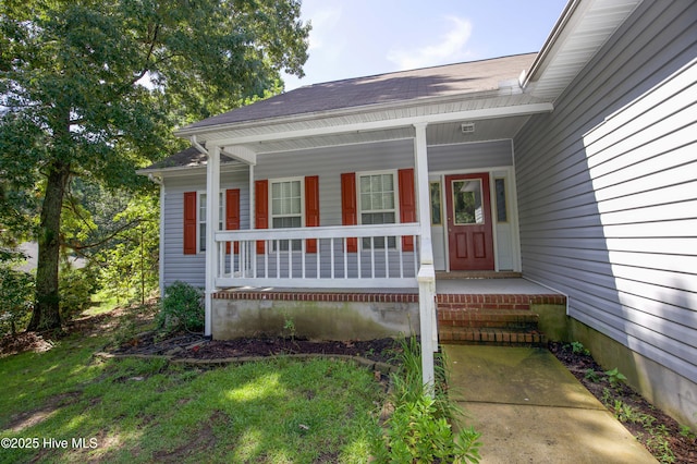 130 Pinecone Ct, Seven Lakes, NC 27376 - view of exterior entry featuring covered porch and roof with shingles