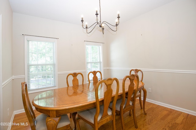 130 Pinecone Ct, Seven Lakes, NC 27376 - dining area with a chandelier and light wood finished floors