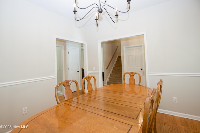 130 Pinecone Ct, Seven Lakes, NC 27376 - dining room with a chandelier, stairs, and wood finished floors