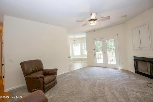 130 Pinecone Ct, Seven Lakes, NC 27376 - living area featuring a fireplace, ceiling fan, and carpet floors