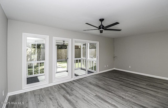 130 Salter Path Rd Unit 74, Pine Knoll Shores, NC 28512 - unfurnished room featuring dark wood-type flooring and ceiling fan