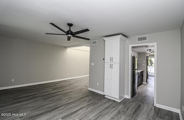 130 Salter Path Rd Unit 74, Pine Knoll Shores, NC 28512 - unfurnished living room featuring a ceiling fan and dark wood-style floors