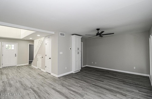 130 Salter Path Rd Unit 74, Pine Knoll Shores, NC 28512 - unfurnished living room featuring wood finished floors, stairway, a ceiling fan, and recessed lighting