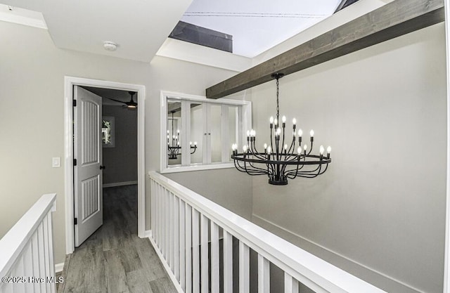 130 Salter Path Rd Unit 74, Pine Knoll Shores, NC 28512 - hallway featuring a chandelier, light wood-type flooring, and an upstairs landing