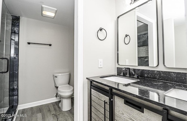 130 Salter Path Rd Unit 74, Pine Knoll Shores, NC 28512 - bathroom with double vanity, wood finished floors, and a shower stall