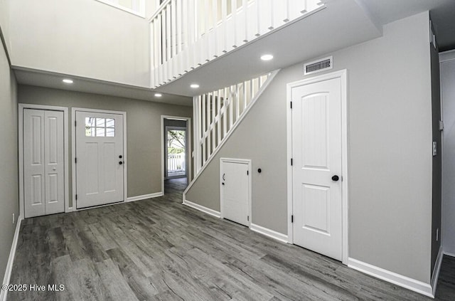 130 Salter Path Rd Unit 74, Pine Knoll Shores, NC 28512 - foyer entrance with stairway, wood finished floors, recessed lighting, and a high ceiling