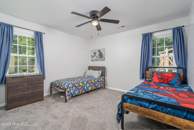 3502 Karen St, New Bern, NC 28560 - bedroom with multiple windows, carpet flooring, and a ceiling fan