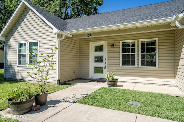 3502 Karen St, New Bern, NC 28560 - property entrance with a shingled roof and a yard