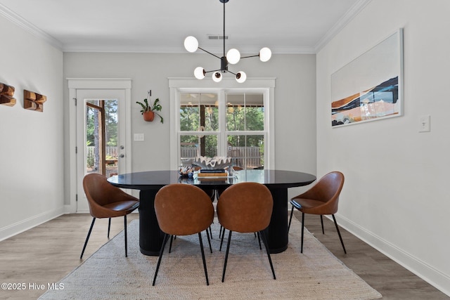 3 Glen Ross Dr, Pinehurst, NC 28374 - dining room with wood finished floors, crown molding, and a chandelier