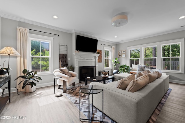 3 Glen Ross Dr, Pinehurst, NC 28374 - living area featuring plenty of natural light, a fireplace, wood finished floors, recessed lighting, and crown molding