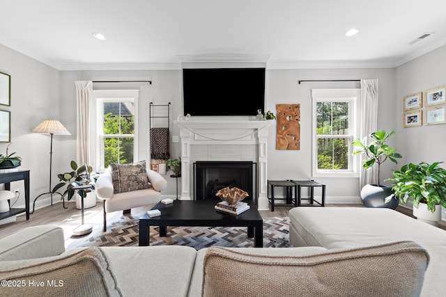 3 Glen Ross Dr, Pinehurst, NC 28374 - living room with healthy amount of natural light, a tile fireplace, crown molding, wood finished floors, and recessed lighting