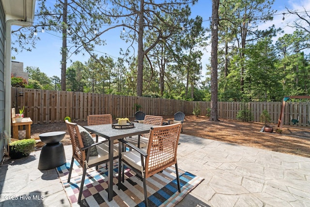 3 Glen Ross Dr, Pinehurst, NC 28374 - fenced backyard with a patio area and outdoor dining space