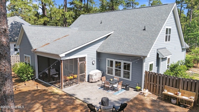 3 Glen Ross Dr, Pinehurst, NC 28374 - back of house featuring roof with shingles, a patio area, and a sunroom