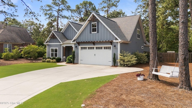 3 Glen Ross Dr, Pinehurst, NC 28374 - craftsman-style home with board and batten siding, driveway, a shingled roof, and a garage
