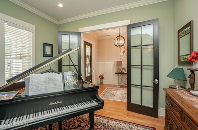 595 Wicklow Sq SW, Ocean Isle Beach, NC 28469 - sitting room with wood finished floors, a chandelier, crown molding, recessed lighting, and wainscoting