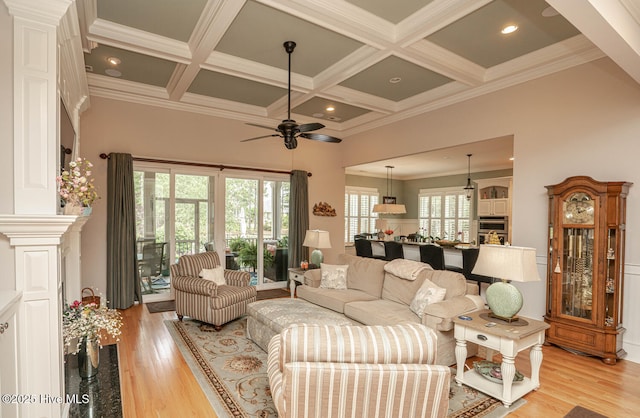 595 Wicklow Sq SW, Ocean Isle Beach, NC 28469 - living room with a ceiling fan, ornamental molding, coffered ceiling, beam ceiling, and light wood finished floors