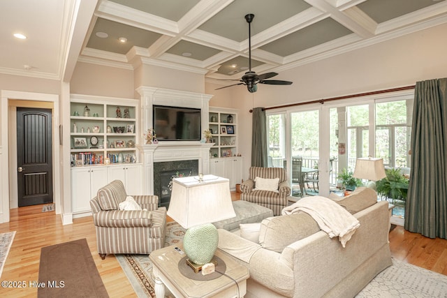 595 Wicklow Sq SW, Ocean Isle Beach, NC 28469 - living room with coffered ceiling, a high end fireplace, ceiling fan, beam ceiling, and crown molding