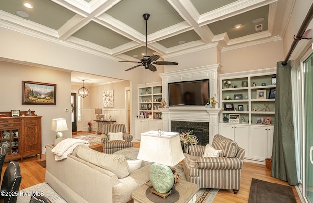 595 Wicklow Sq SW, Ocean Isle Beach, NC 28469 - living room with light wood-style floors, coffered ceiling, a high end fireplace, crown molding, and a ceiling fan