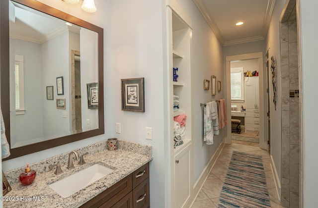 595 Wicklow Sq SW, Ocean Isle Beach, NC 28469 - full bath featuring crown molding, vanity, tile patterned flooring, built in shelves, and recessed lighting