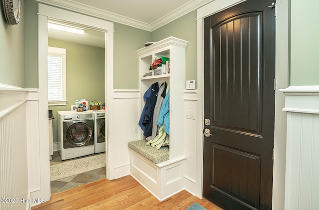 595 Wicklow Sq SW, Ocean Isle Beach, NC 28469 - washroom with independent washer and dryer, light wood-style floors, a wainscoted wall, crown molding, and a decorative wall