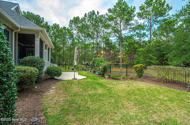 595 Wicklow Sq SW, Ocean Isle Beach, NC 28469 - view of yard featuring a patio and view of scattered trees