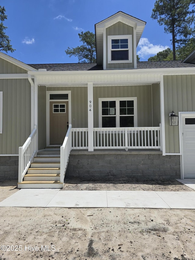 904 Nautillus Ct, New Bern, NC 28560 - entrance to property with a porch, board and batten siding, and a shingled roof