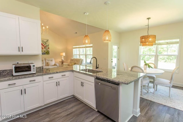 430 Boundaryline Dr NW, Calabash, NC 28467 - kitchen featuring dishwasher, dark wood-style floors, white cabinetry, light stone countertops, and decorative light fixtures