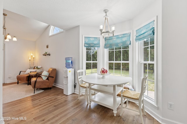 103 Coppers Trl, Wilmington, NC 28411 - dining space with a chandelier, light wood-style flooring, plenty of natural light, and vaulted ceiling