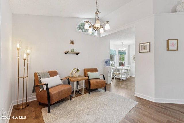 103 Coppers Trl, Wilmington, NC 28411 - sitting room with a chandelier, wood finished floors, and vaulted ceiling