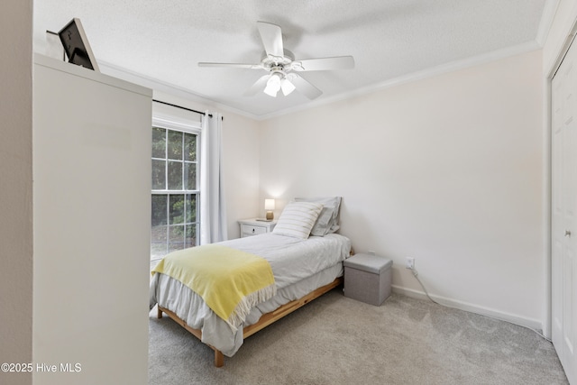 103 Coppers Trl, Wilmington, NC 28411 - bedroom with ornamental molding, carpet flooring, a ceiling fan, a textured ceiling, and a closet
