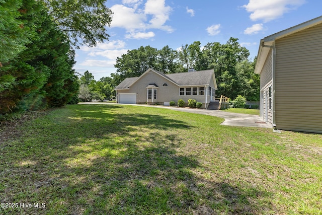 103 Coppers Trl, Wilmington, NC 28411 - view of green lawn with an attached garage