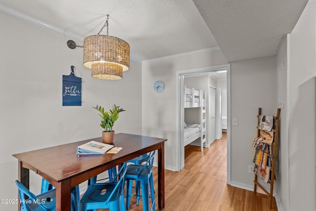 1004 Carolina Beach Ave S Unit B6, Carolina Beach, NC 28428 - dining area with light wood-style flooring, a textured ceiling, ornamental molding, and an office area