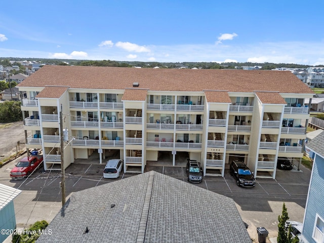 1004 Carolina Beach Ave S Unit B6, Carolina Beach, NC 28428 - view of apartment building / complex featuring uncovered parking