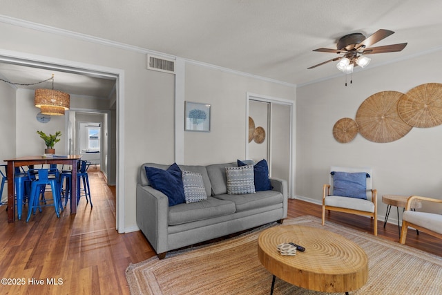 1004 Carolina Beach Ave S Unit B6, Carolina Beach, NC 28428 - living room with wood finished floors, ornamental molding, and ceiling fan