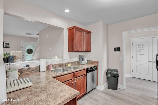 203 Mccain St, Beulaville, NC 28518 - kitchen featuring stainless steel dishwasher, light countertops, light wood-style flooring, brown cabinetry, and recessed lighting