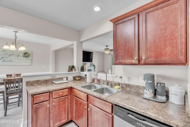 203 Mccain St, Beulaville, NC 28518 - kitchen with stainless steel dishwasher, light countertops, a peninsula, hanging light fixtures, and a ceiling fan