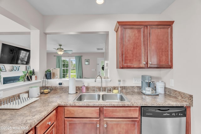 203 Mccain St, Beulaville, NC 28518 - kitchen with stainless steel dishwasher, a ceiling fan, light countertops, and brown cabinetry