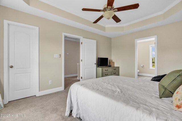 203 Mccain St, Beulaville, NC 28518 - bedroom with a tray ceiling, carpet floors, crown molding, ensuite bath, and a ceiling fan