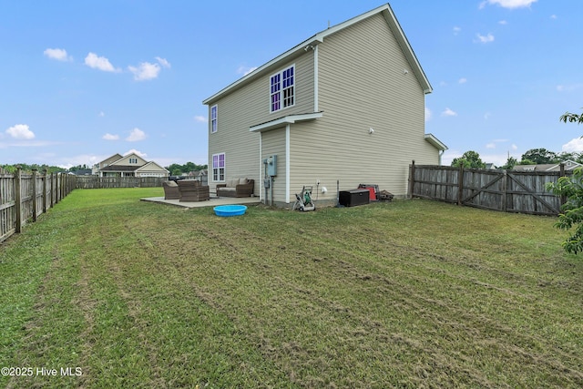 203 Mccain St, Beulaville, NC 28518 - back of property featuring an outdoor living space, a fenced backyard, and a patio area