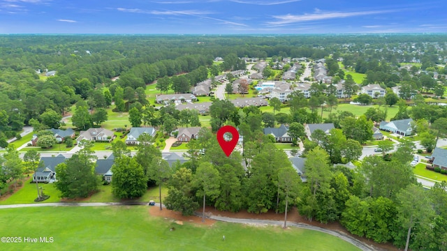 1514 Grandiflora Dr, Leland, NC 28451 - aerial perspective of suburban area featuring a forest