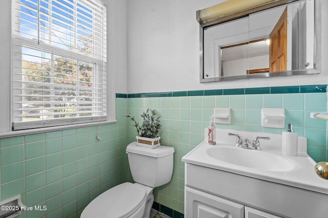 6074 NC-42 Hwy W, Macclesfield, NC 27852 - half bath featuring vanity, tile walls, and a wainscoted wall