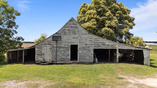 6074 NC-42 Hwy W, Macclesfield, NC 27852 - back of property featuring a yard and an outbuilding