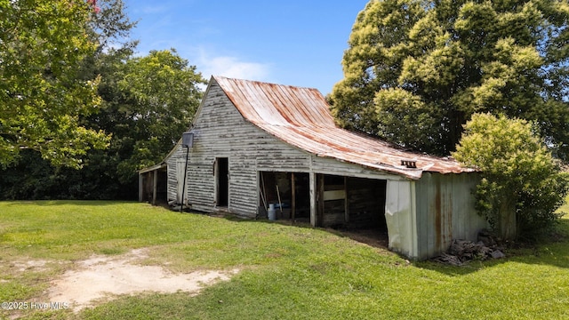 6074 NC-42 Hwy W, Macclesfield, NC 27852 - view of barn featuring a yard