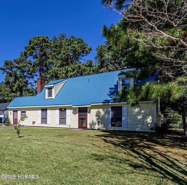 105 Woodside Ct, Jacksonville, NC 28546 - view of front of home with a front lawn, a metal roof, and a chimney